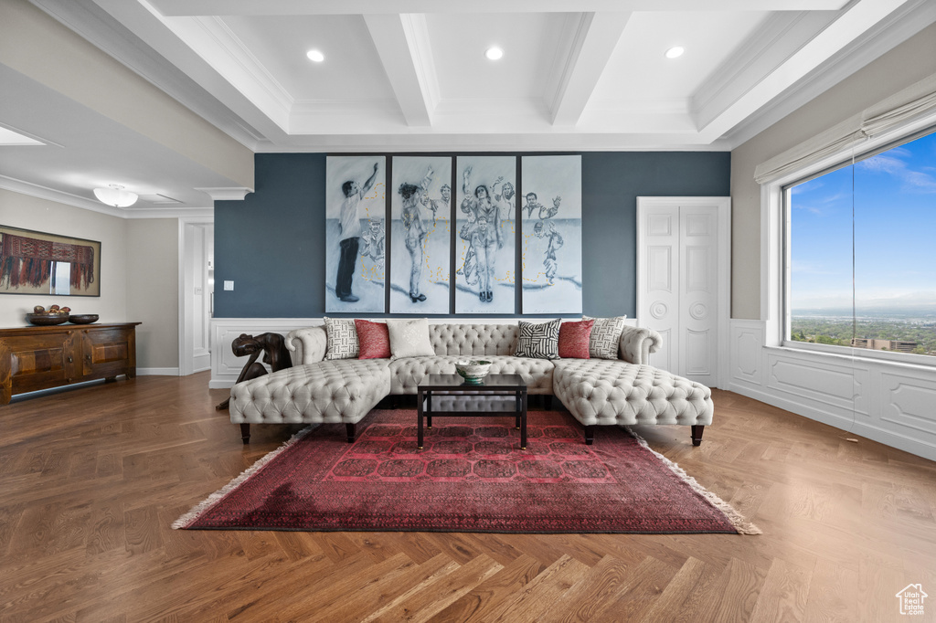 Living area with wainscoting, recessed lighting, beamed ceiling, and ornamental molding