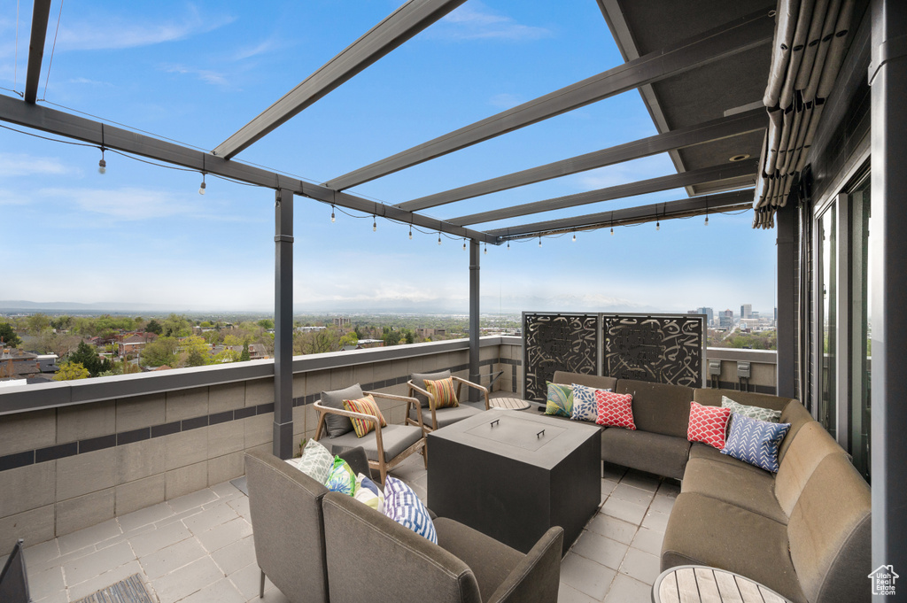 View of patio / terrace featuring an outdoor hangout area and a pergola