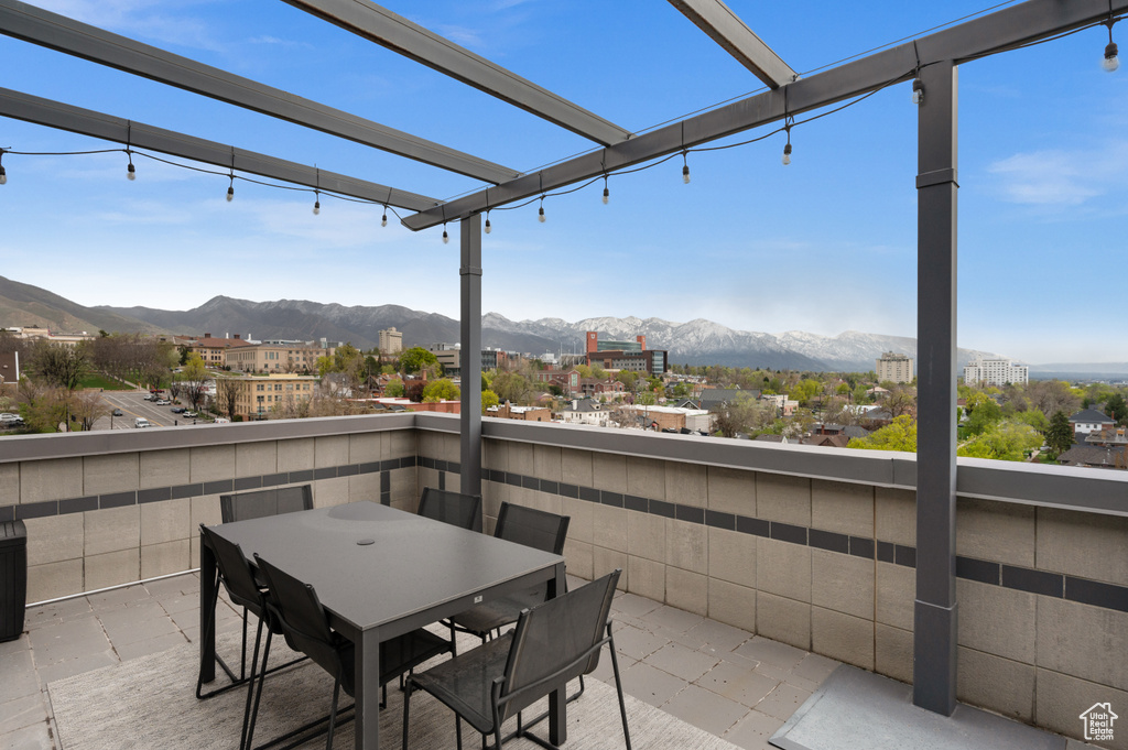 View of patio featuring a mountain view and outdoor dining space