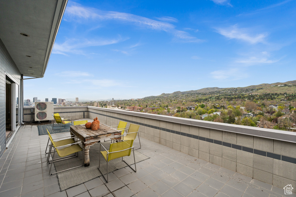 Balcony with a mountain view and ac unit