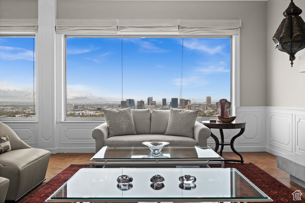 Living room featuring a wainscoted wall