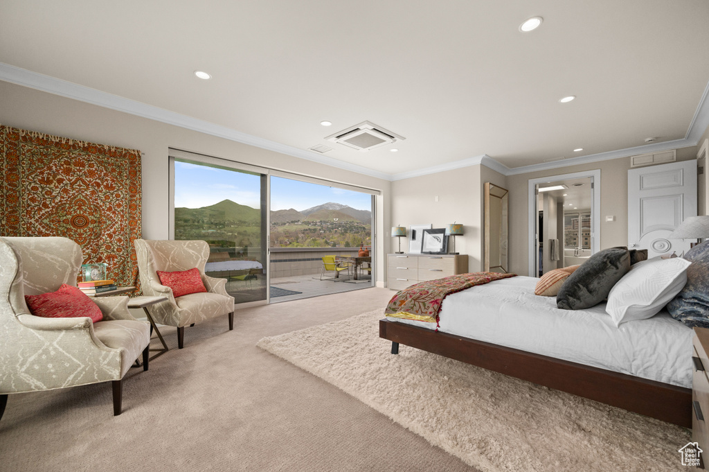 Bedroom with carpet floors, recessed lighting, and crown molding