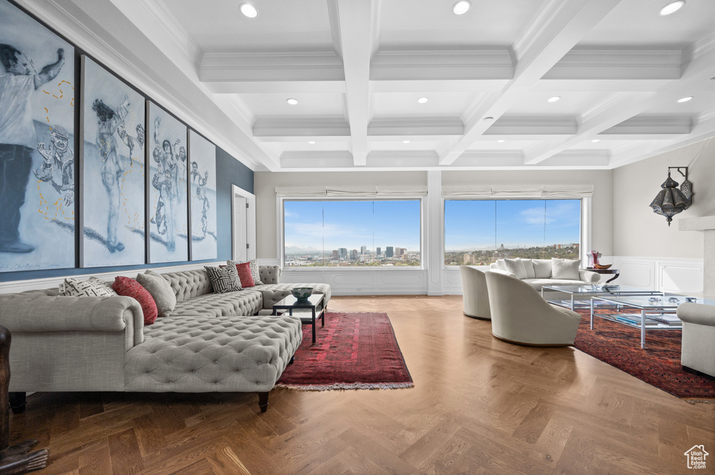 Living room featuring crown molding, wainscoting, beam ceiling, recessed lighting, and coffered ceiling