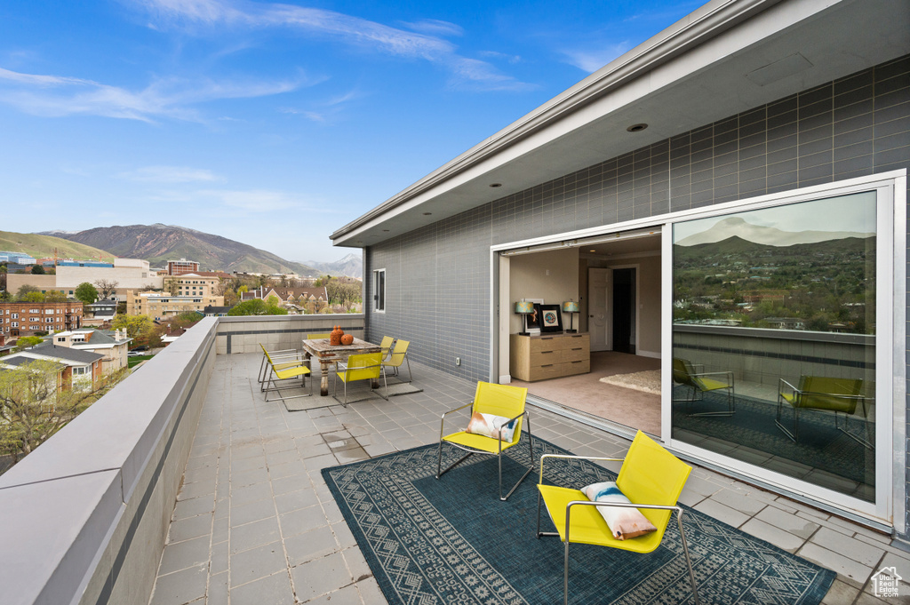 View of patio featuring a mountain view and outdoor dining space