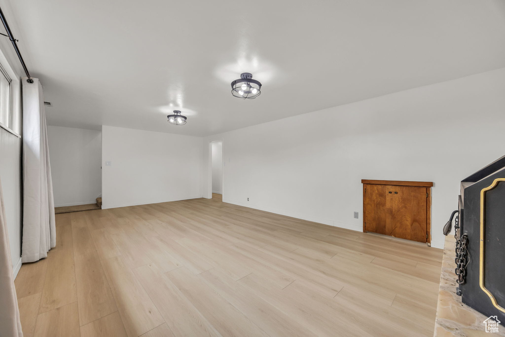 Unfurnished living room with light wood-style flooring