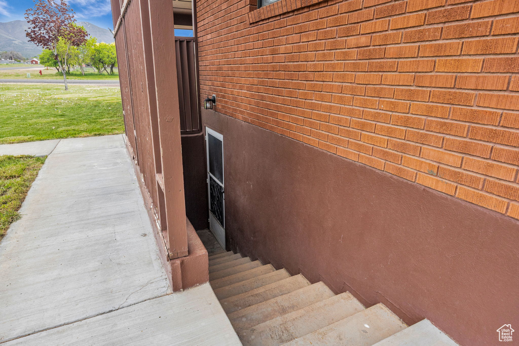 View of home's exterior featuring brick siding and a mountain view