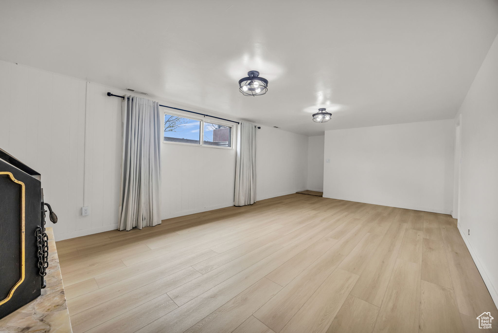 Unfurnished living room with light wood finished floors