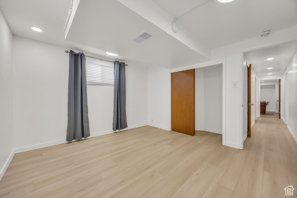 Unfurnished bedroom featuring recessed lighting, baseboards, visible vents, and light wood-style floors