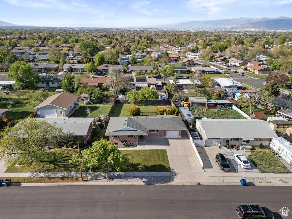 Birds eye view of property with a mountain view and a residential view