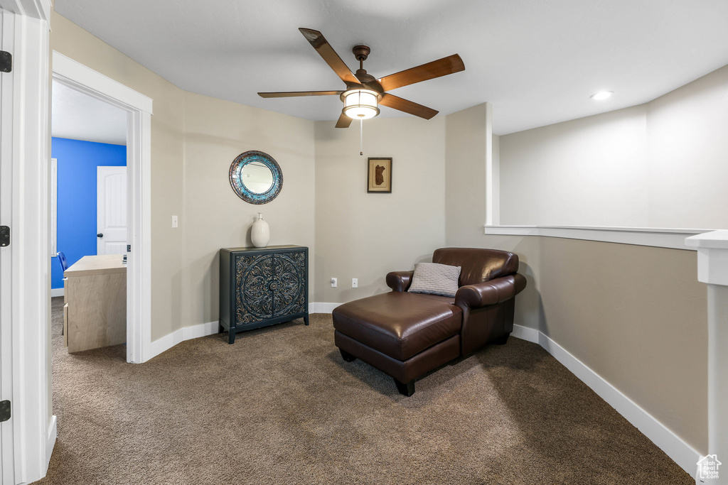 Living area featuring carpet flooring, recessed lighting, ceiling fan, and baseboards