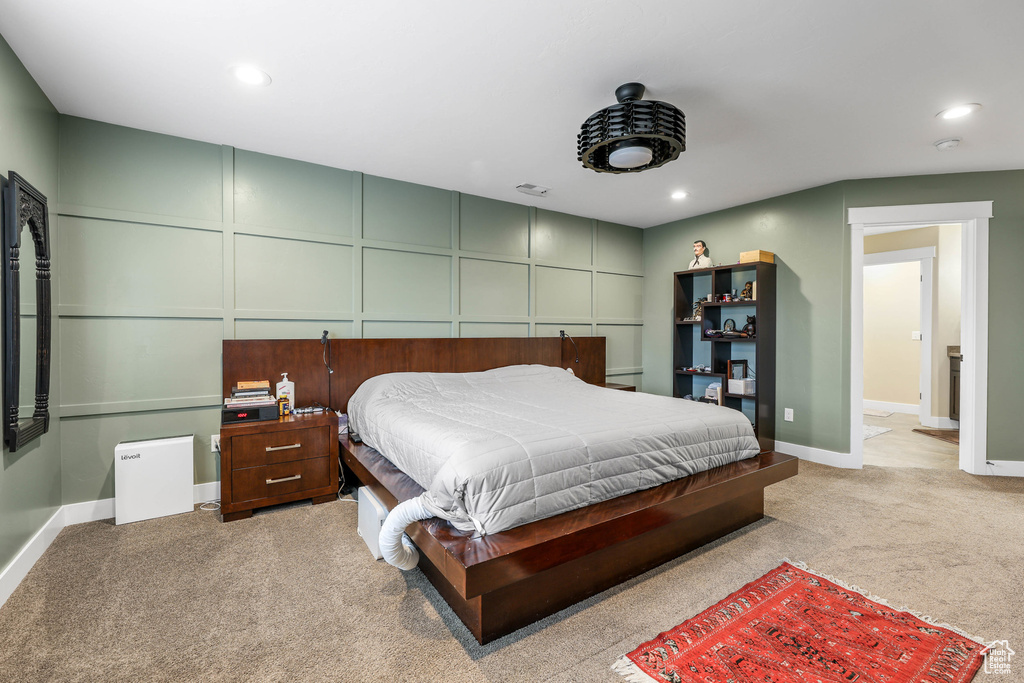 Carpeted bedroom with baseboards and recessed lighting