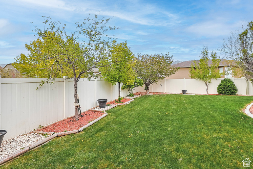 View of yard with a fenced backyard