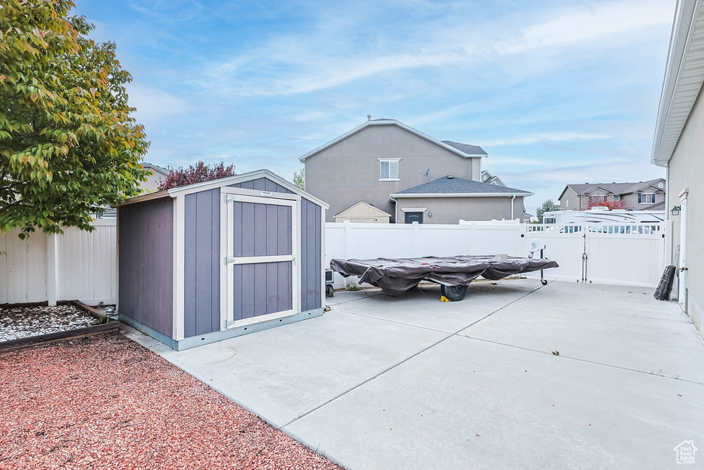 View of shed featuring a fenced backyard