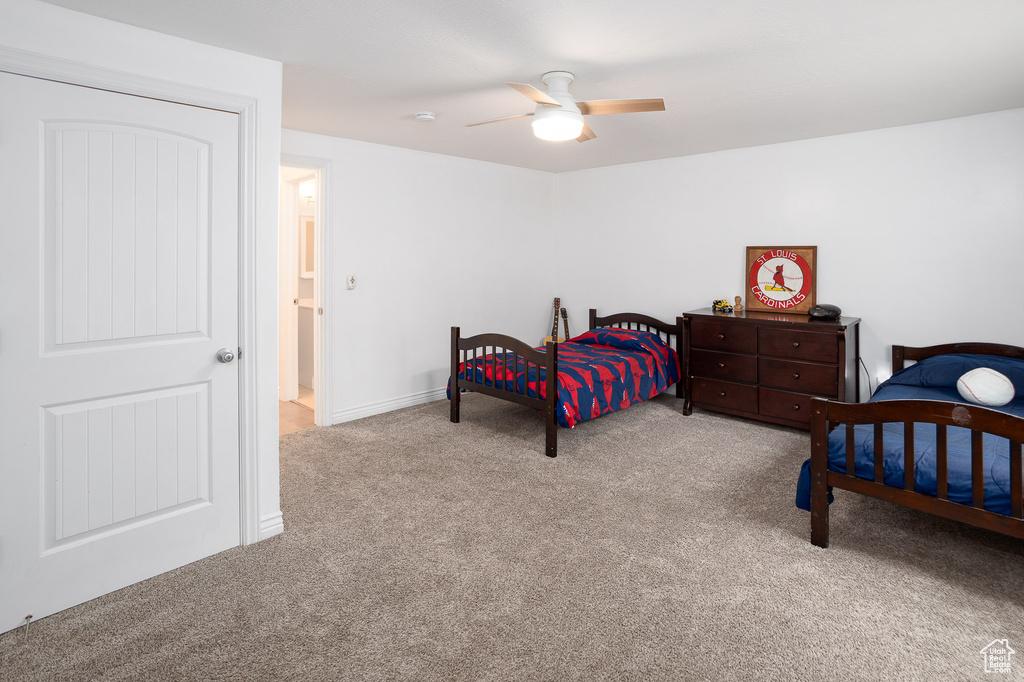 Bedroom with carpet and ceiling fan