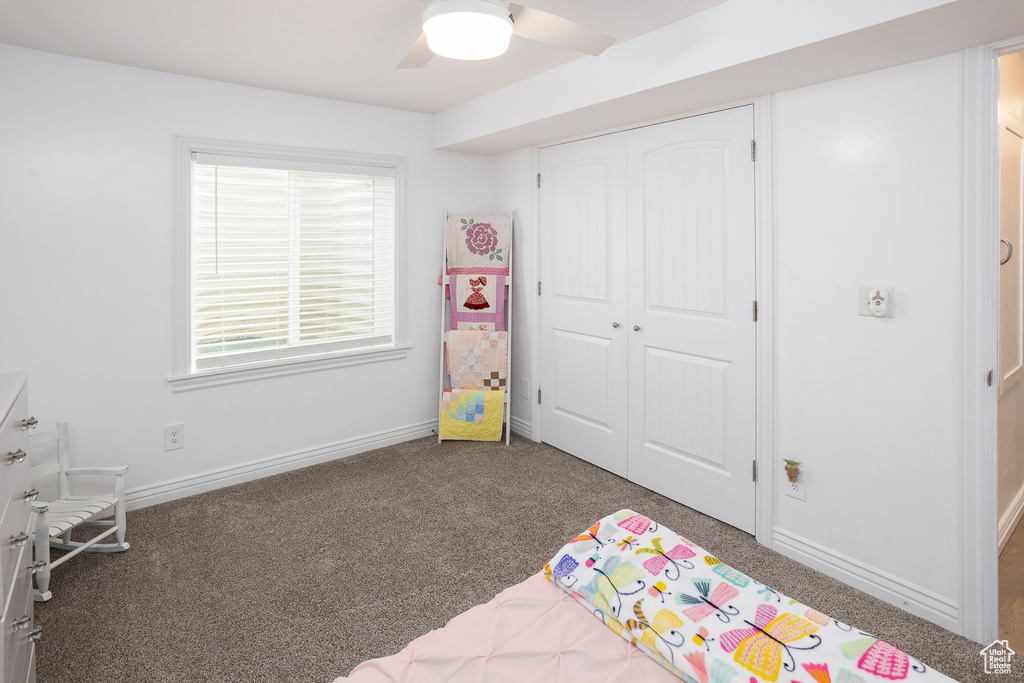 Rec room featuring carpet floors, a ceiling fan, and baseboards