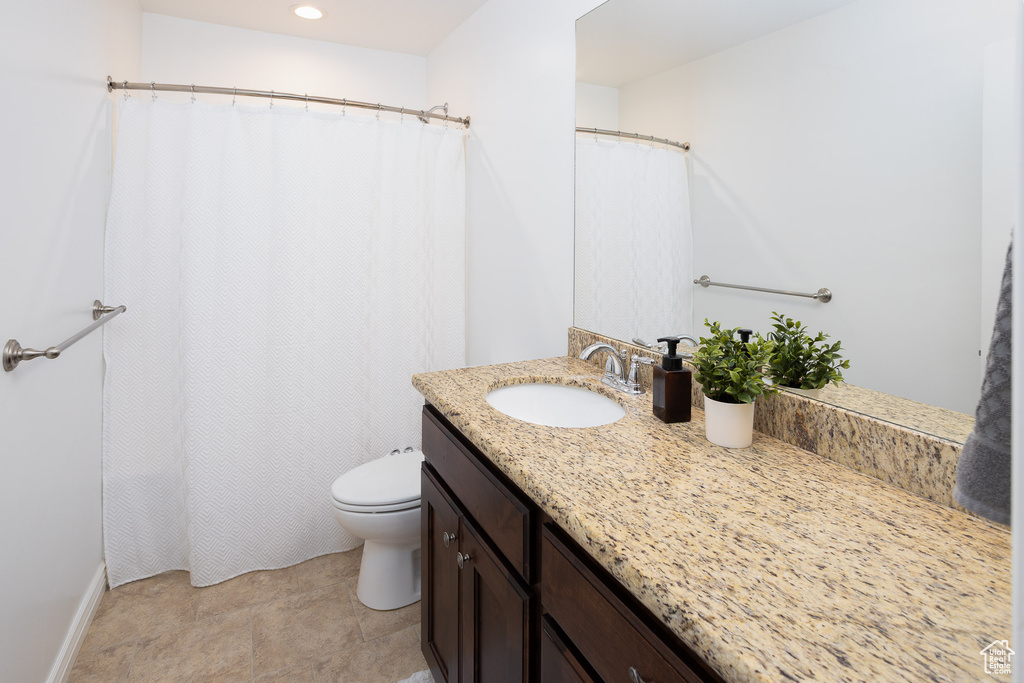Bathroom featuring toilet and vanity