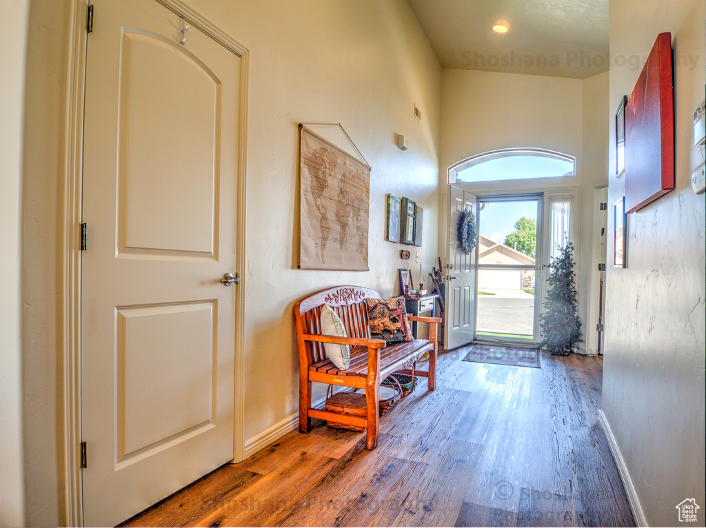Foyer entrance featuring baseboards and wood finished floors