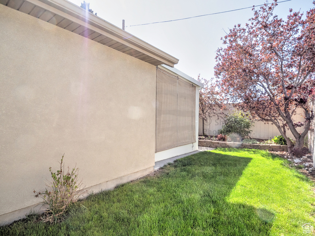 View of yard featuring fence
