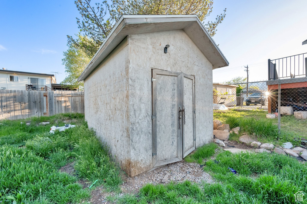 View of shed with a fenced backyard