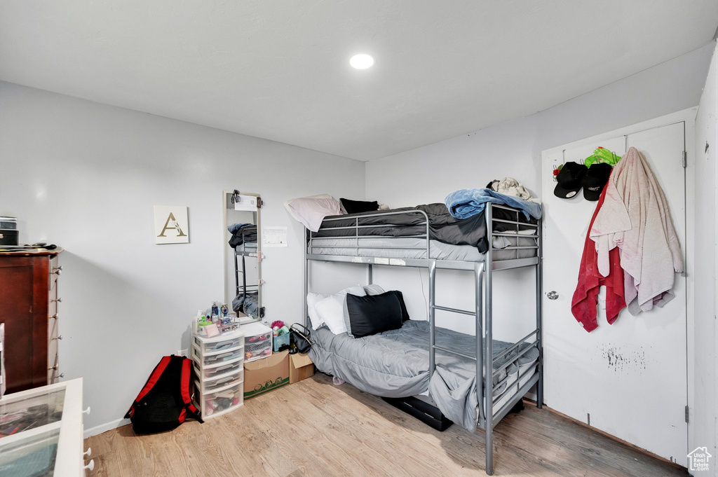Bedroom featuring recessed lighting and wood finished floors
