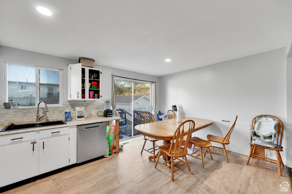 Dining room featuring recessed lighting and light wood-style flooring