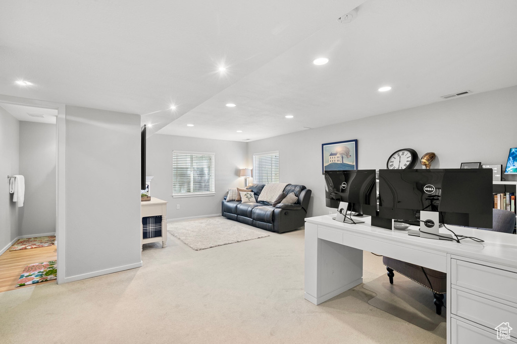 Office with baseboards, light carpet, recessed lighting, and visible vents