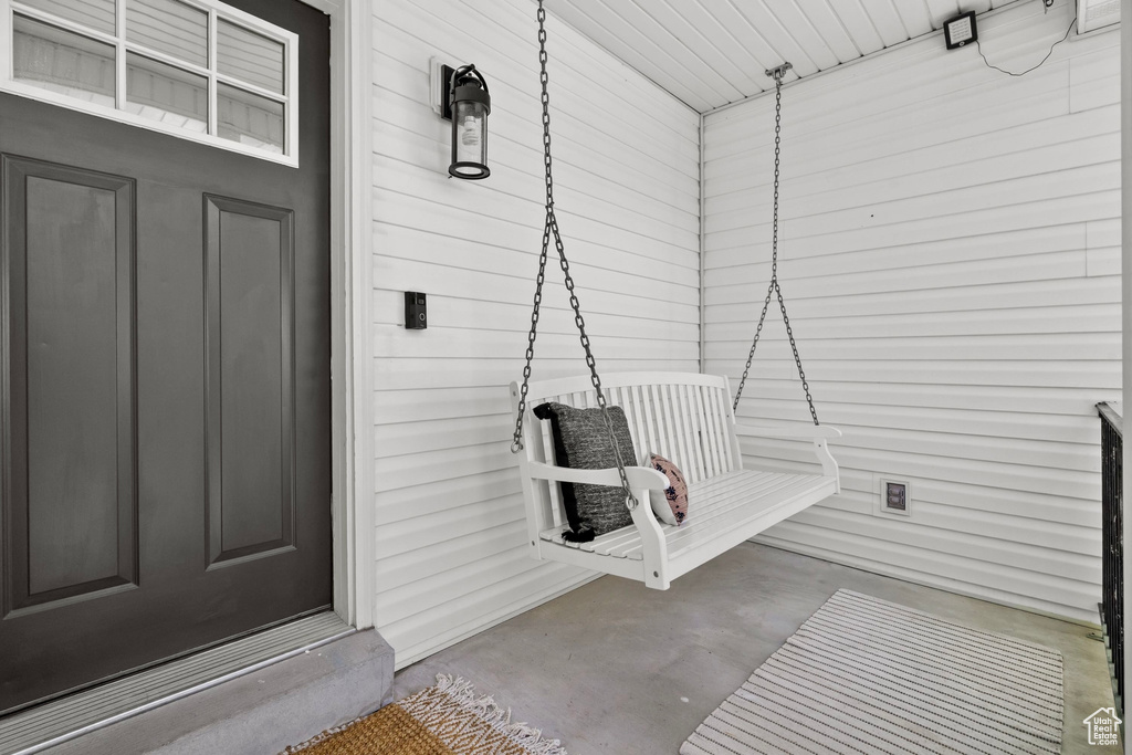 Entrance to property featuring a porch