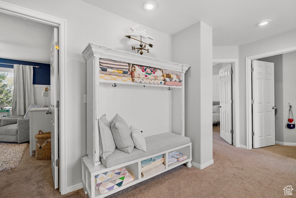 Mudroom featuring recessed lighting, baseboards, and carpet