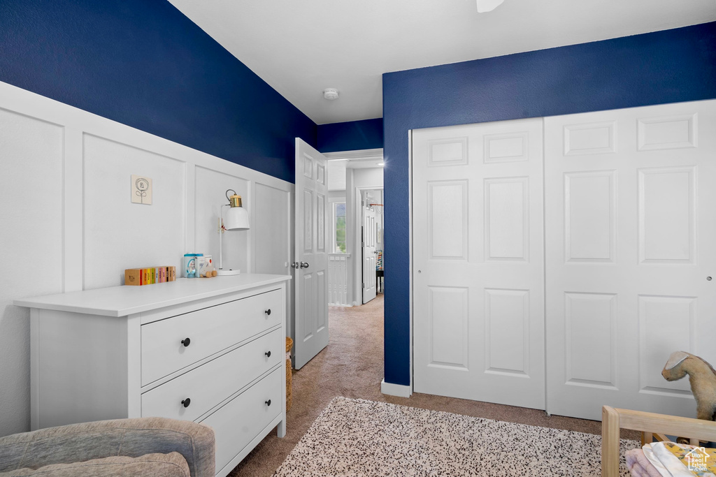 Bedroom with light carpet