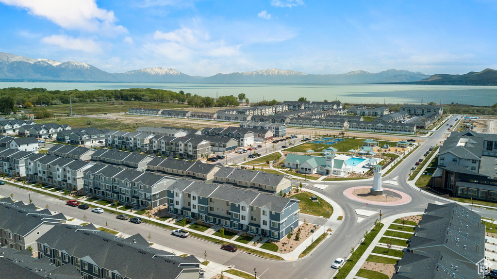 Drone / aerial view with a water and mountain view