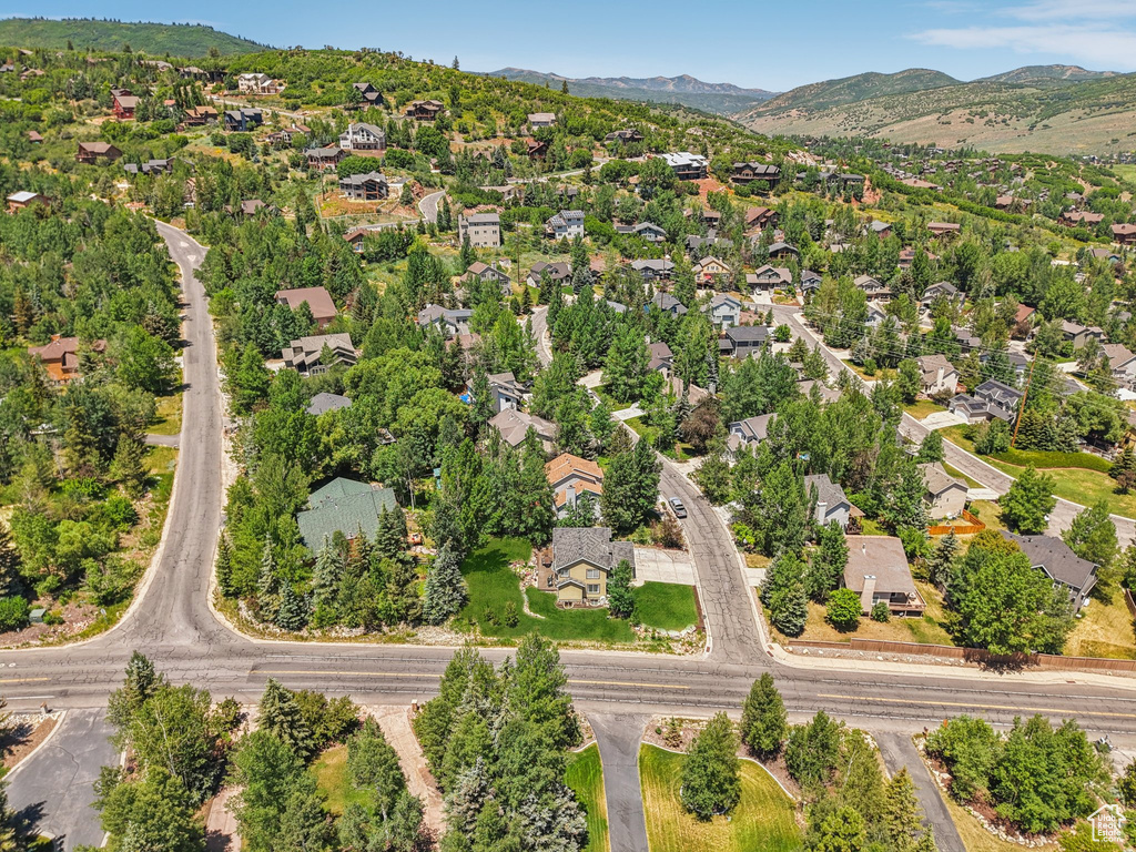 Aerial view of property\\\\\\\'s location featuring nearby suburban area and a mountain backdrop