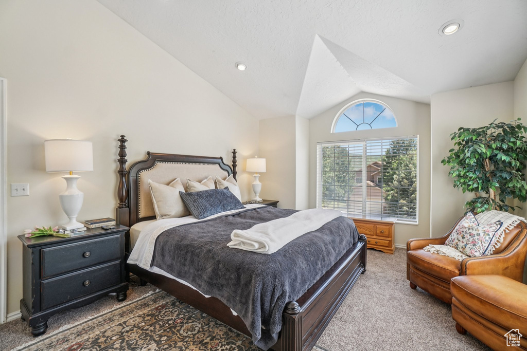 Bedroom with carpet flooring, vaulted ceiling, and recessed lighting