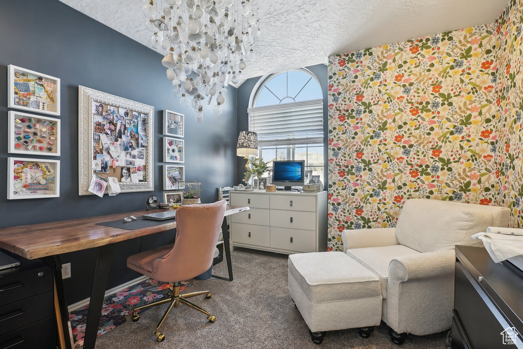 Carpeted office space featuring a textured ceiling