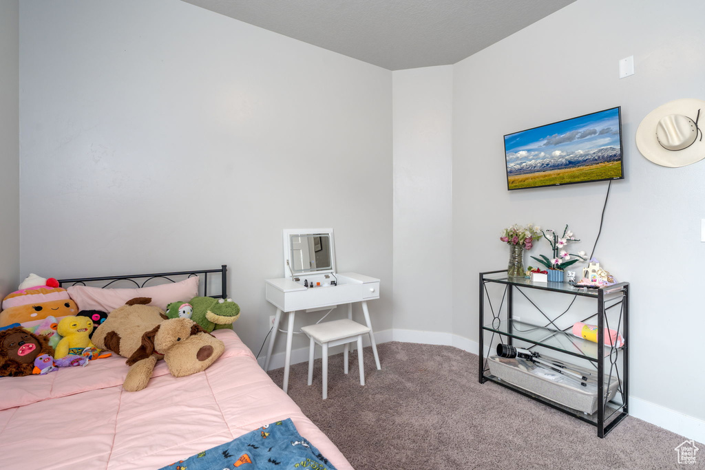 Carpeted bedroom with baseboards