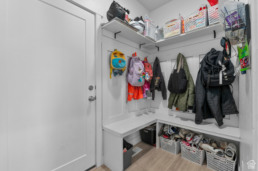 Mudroom with light wood-style flooring