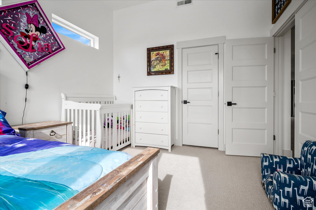 Bedroom with carpet and visible vents