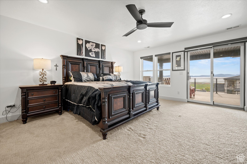 Bedroom with visible vents, access to exterior, baseboards, recessed lighting, and light colored carpet