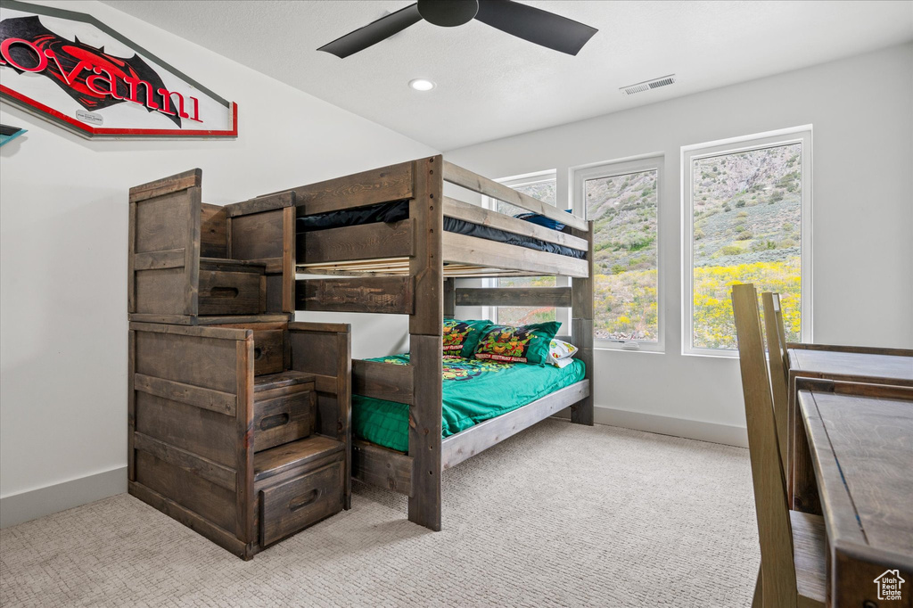 Carpeted bedroom featuring recessed lighting, baseboards, visible vents, and a ceiling fan