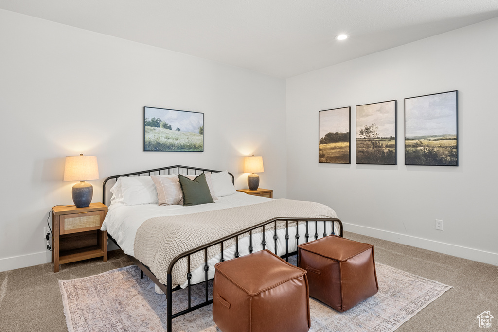 Carpeted bedroom featuring recessed lighting and baseboards