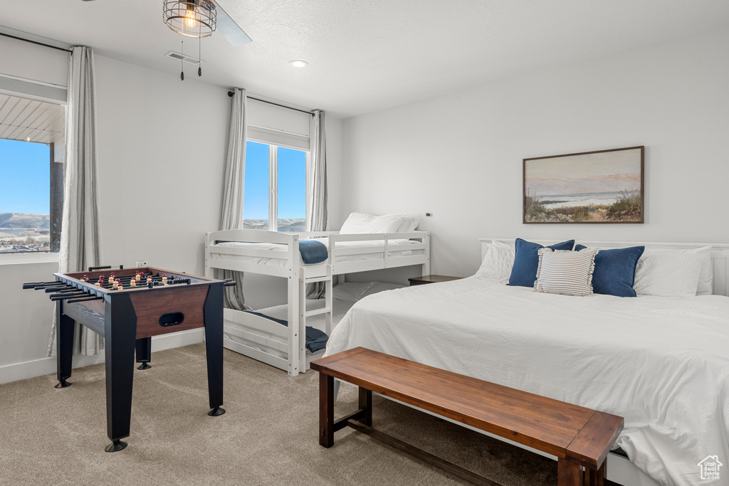 Bedroom featuring visible vents, recessed lighting, and light carpet