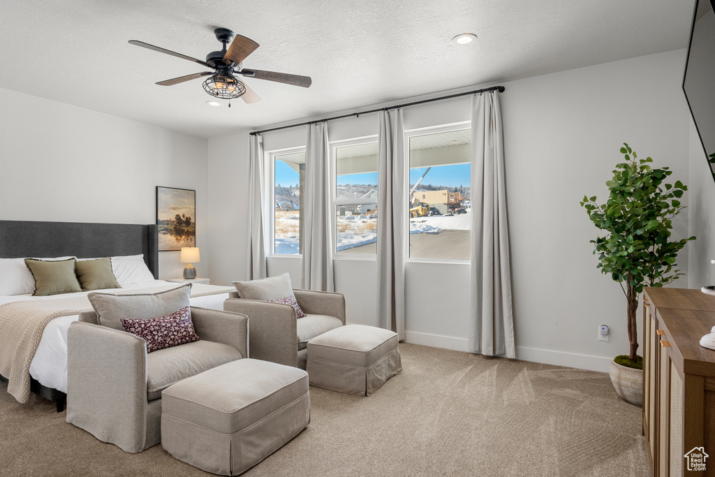Bedroom featuring baseboards, light carpet, a ceiling fan, and recessed lighting