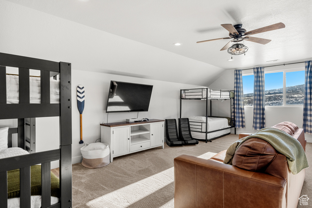 Bedroom featuring a ceiling fan, vaulted ceiling, recessed lighting, and light colored carpet