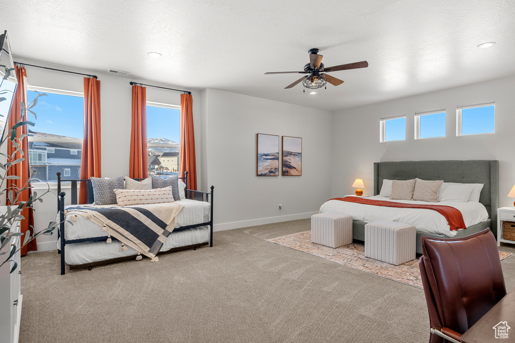 Bedroom with carpet floors, visible vents, baseboards, recessed lighting, and a ceiling fan