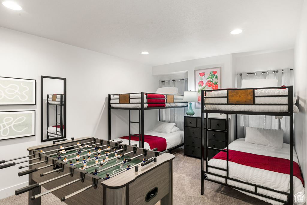 Carpeted bedroom with recessed lighting and baseboards