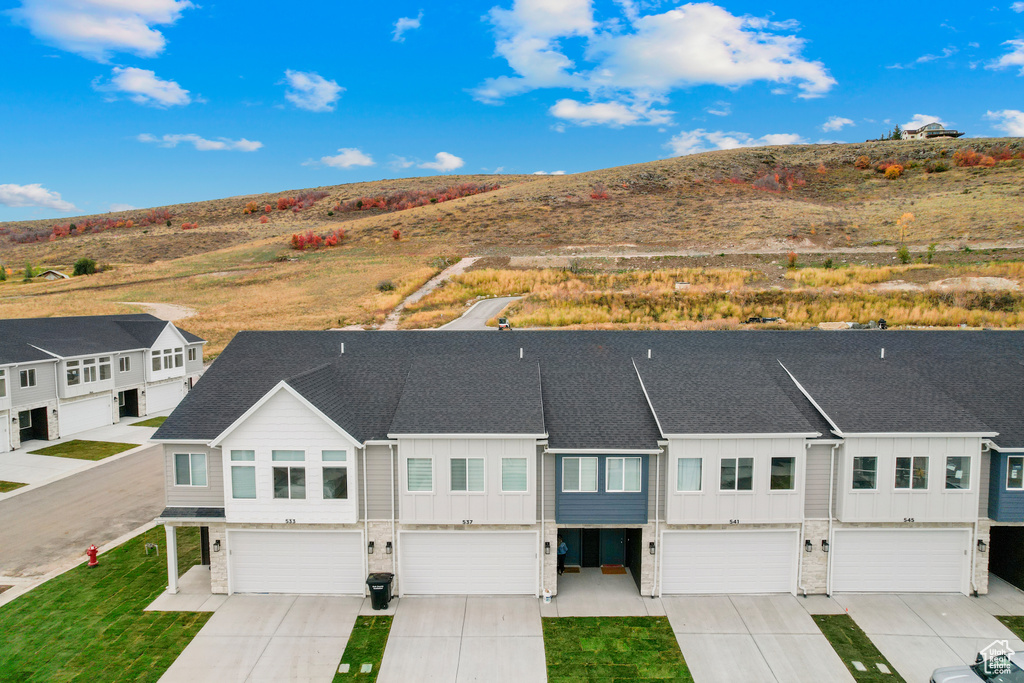 Birds eye view of property with a mountain view