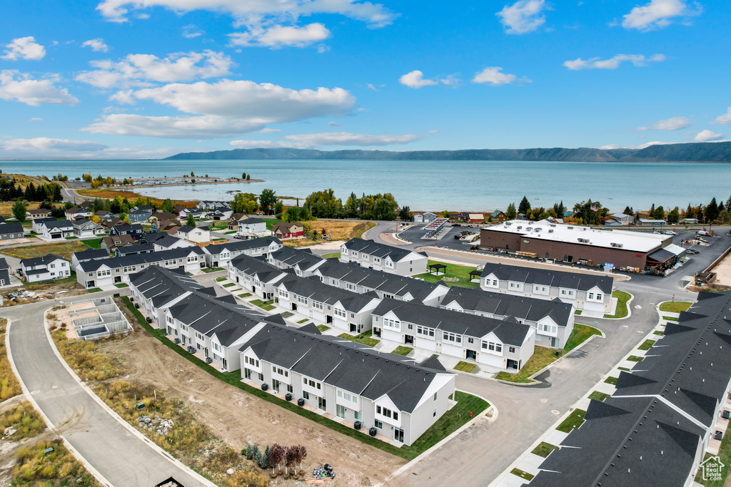 Aerial view featuring a water view and a residential view