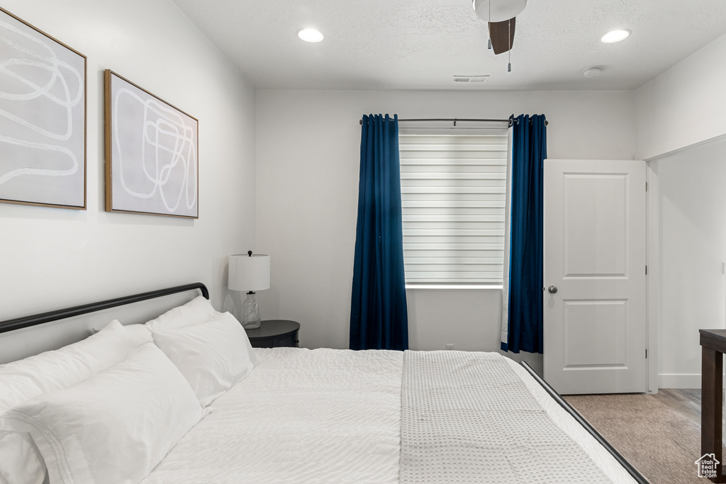 Bedroom featuring recessed lighting, a ceiling fan, and visible vents