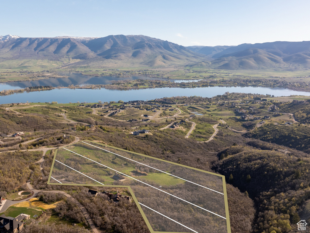 Bird's eye view with a water and mountain view