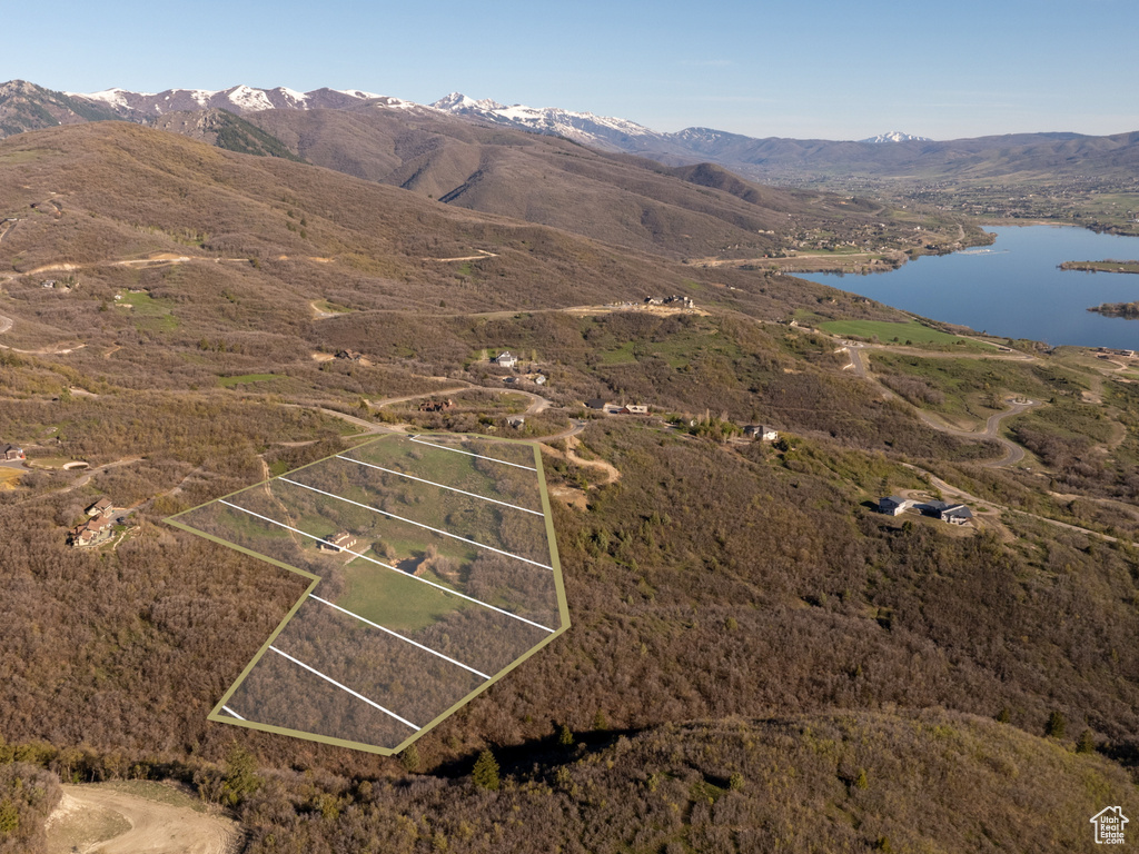 Drone / aerial view with a water and mountain view