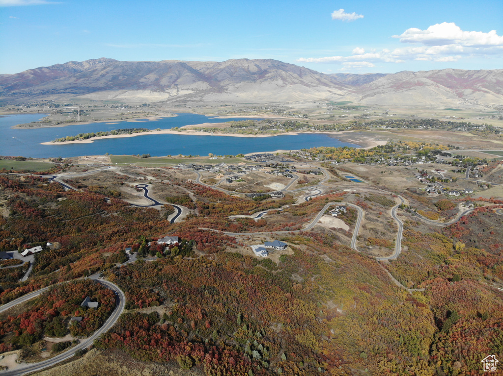 Aerial view featuring a water and mountain view